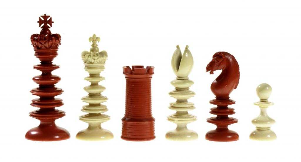 Appraisal: A FINE ENGLISH IVORY PRESENTATION CHESS SET turned and carved