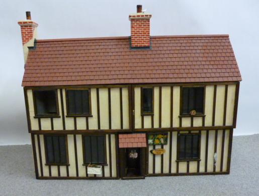 Appraisal: A two storey dolls house scratch built wood and paint