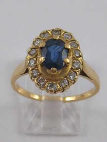 Appraisal: A yellow metal tests carat gold sapphire and diamond cluster