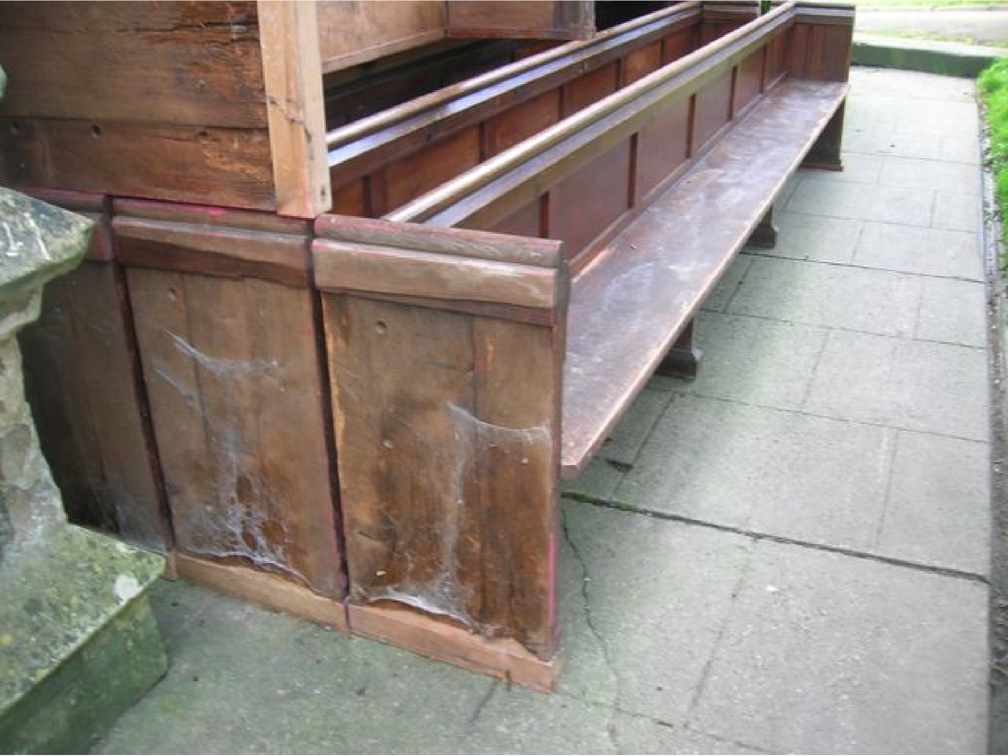 Appraisal: A pair of reclaimed stained pine and elm church pews