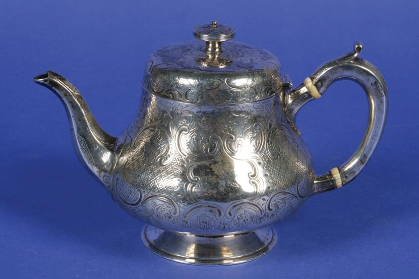 Appraisal: A VICTORIAN IRISH TEAPOT of bellied circular form the hinged