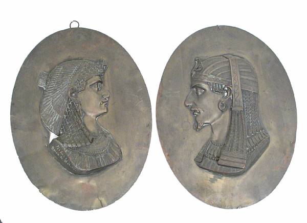 Appraisal: A pair of French Egyptian Revival brass oval plaques height