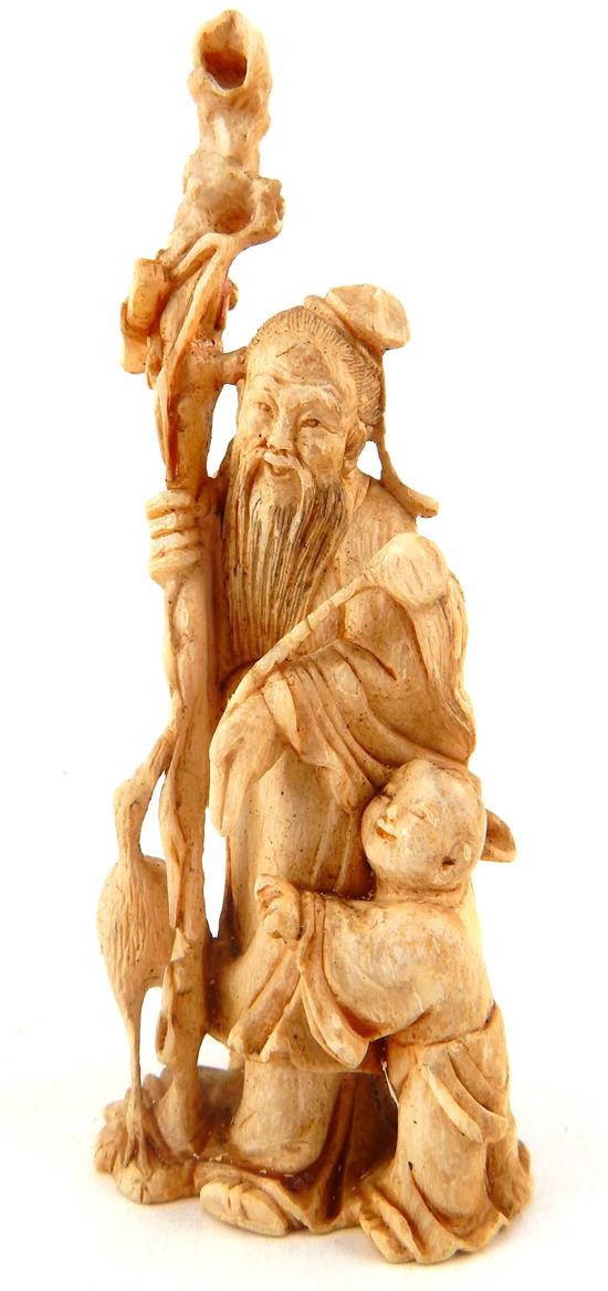 Appraisal: ASIAN th C Chinese carved ivory figure depicting elder holding