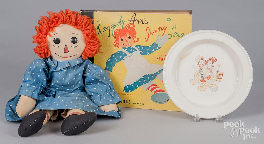 Appraisal: Raggedy Ann doll bowl and album set Raggedy Ann doll