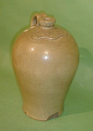 Appraisal: A stoneware flagon with impressed tablet Joseph Petty Darley Near