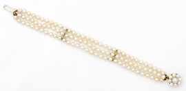 Appraisal: A triple strand to mm cultured freshwater pearl bracelet on