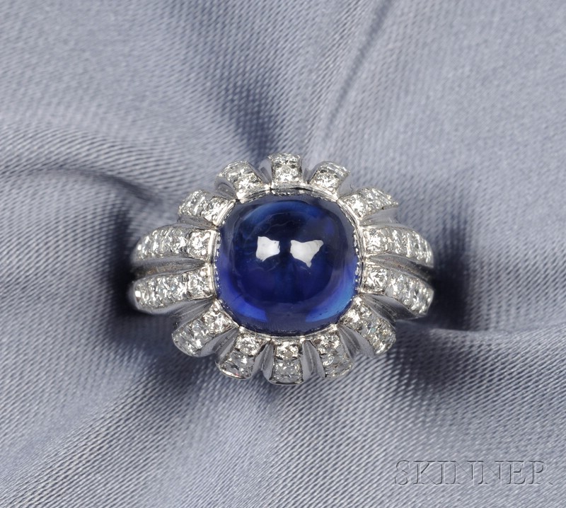 Appraisal: Platinum Sapphire and Diamond Ring set with a high-domed cabochon