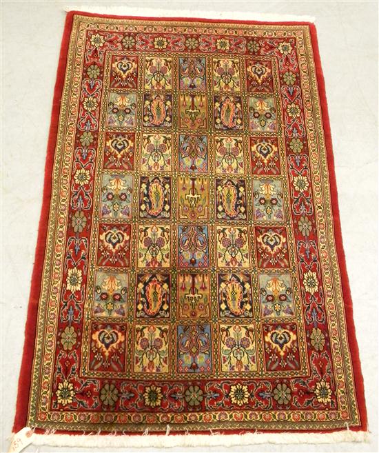 Appraisal: Persian design handknotted rug red field with two borders '