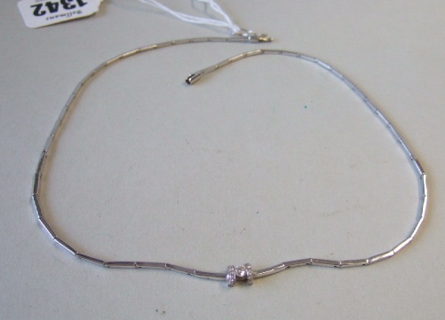 Appraisal: A white gold and diamond set necklace the front mounted