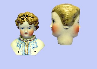 Appraisal: Pair of Parian doll heads shoulderhead with blonde painted curly