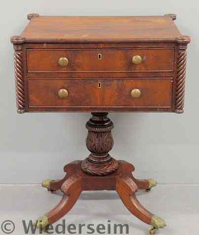 Appraisal: Empire mahogany two-drawer stand c with a turret corner top