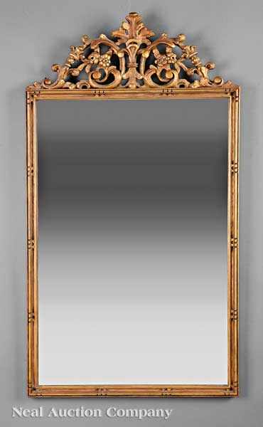 Appraisal: A Rococo-Style Gilt Mirror elaborate foliate crest with acanthine finial