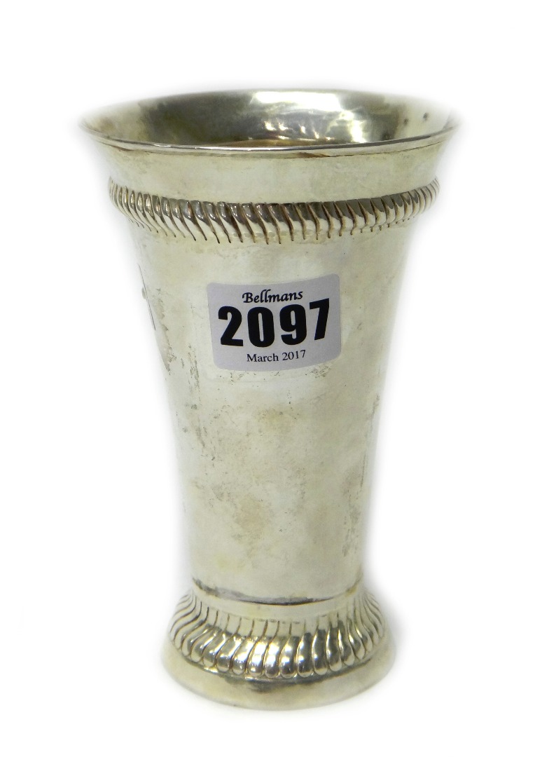 Appraisal: A silver beaker of tapering cylindrical form decorated with serpentine