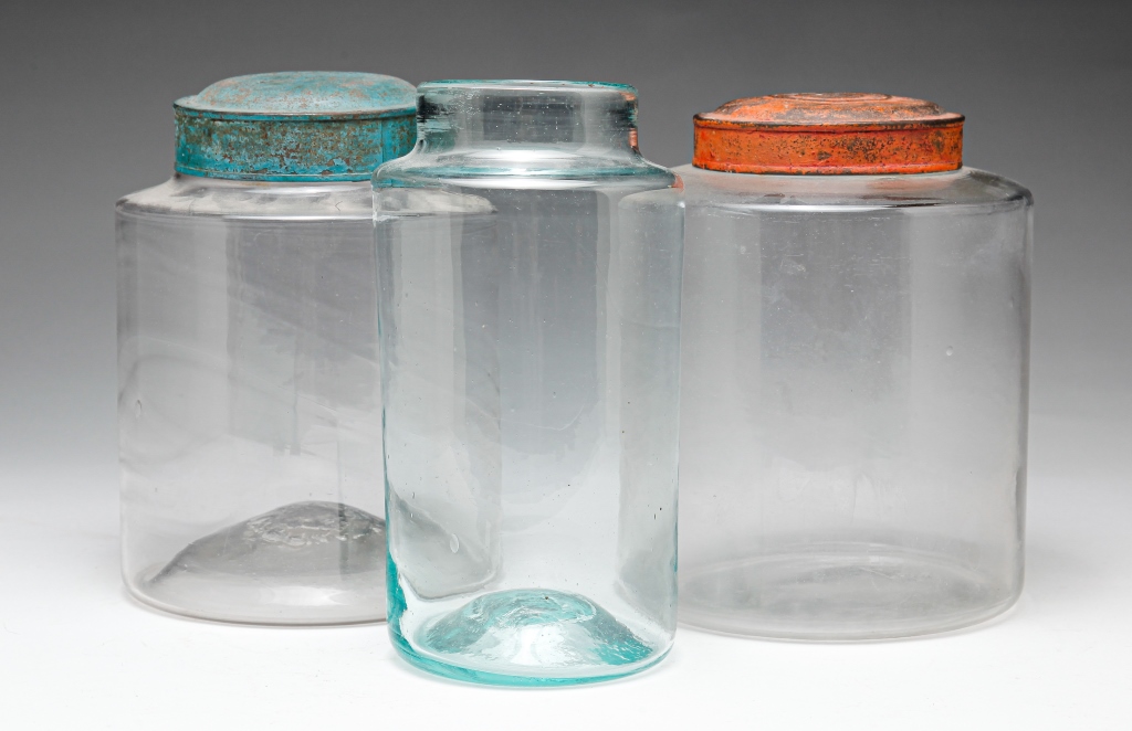 Appraisal: THREE AMERICAN GLASS CANISTERS Nineteenth century Two early blown canisters