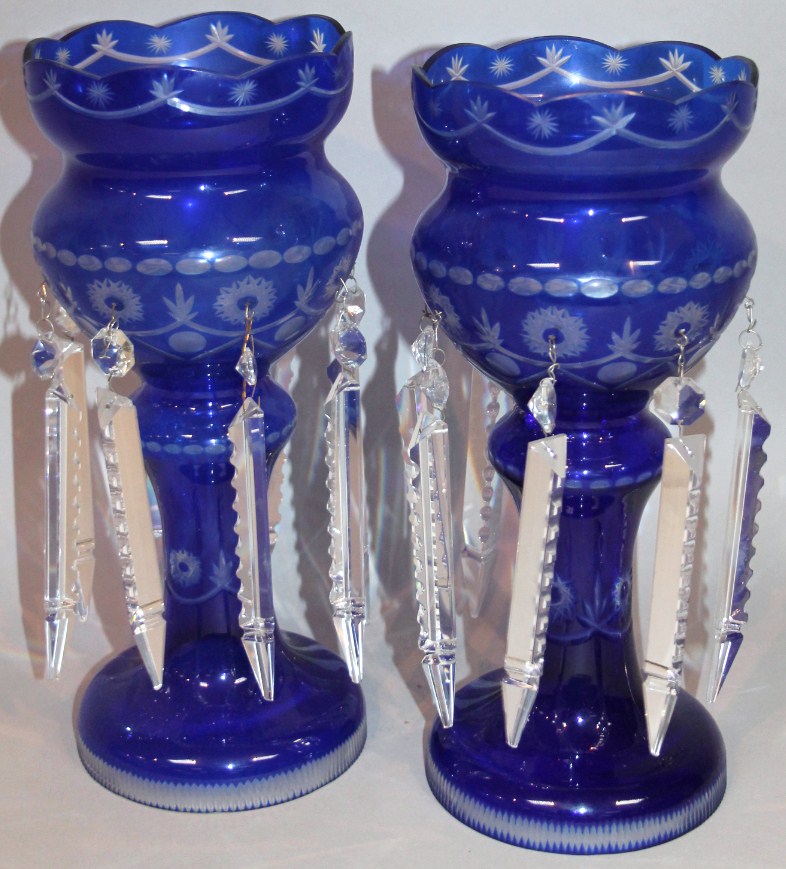 Appraisal: A pair of Victorian blue and clear glass lustres each