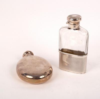 Appraisal: An oval silver hip flask Birmingham with screw off cover