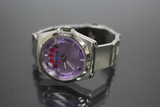 Appraisal: A PAUL SMITH STEEL CASED WRIST WATCH with pink dial