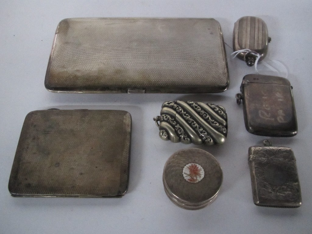 Appraisal: Lot comprising two silver cigarette cases two silver vestas a