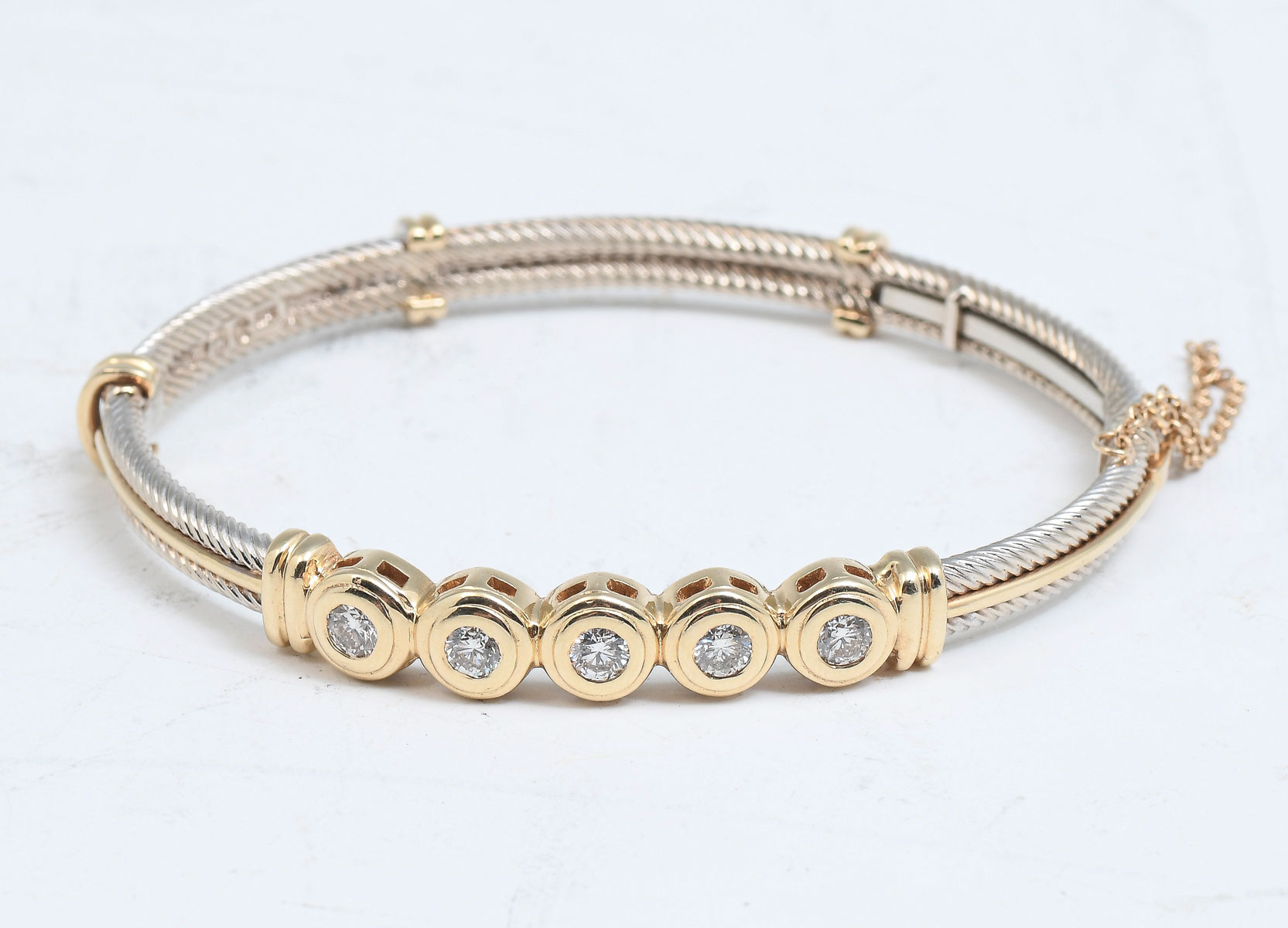 Appraisal: STYLISH TONE K DIAMOND BANGLE Great looking bangle is set