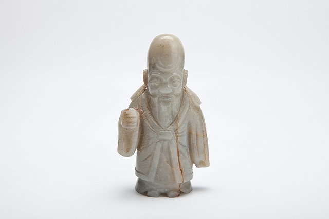 Appraisal: A CHINESE PROVINCIAL JADE FIGURE OF A STANDING SHOU LAO