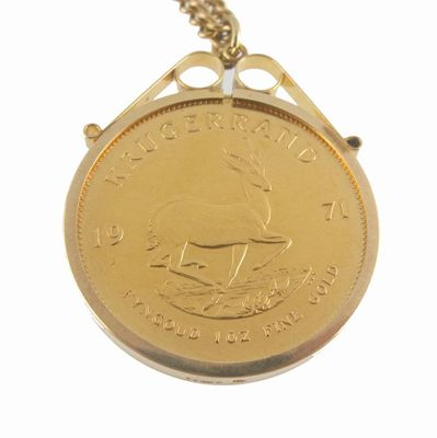 Appraisal: A Krugerrand gold coin mounted gold pendant on a gold