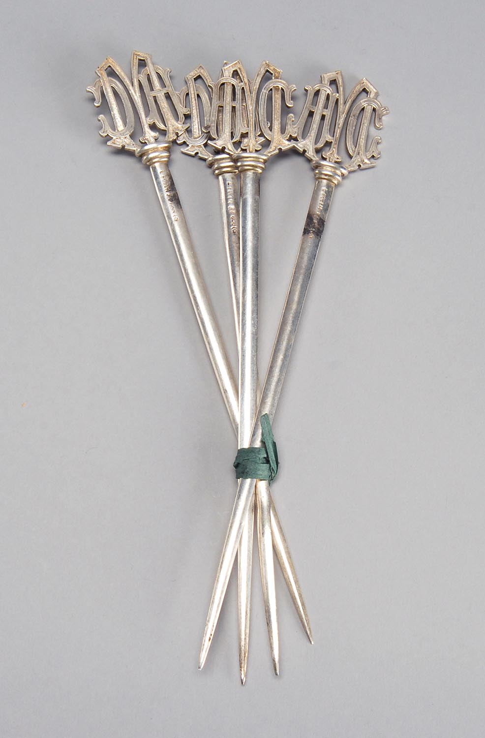 Appraisal: FOUR CONTINENTAL SILVER MEAT SKEWERS Monogrammed Marked and L Posen