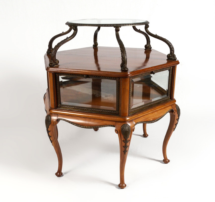 Appraisal: UNIQUE VITRINE DISPLAY OCCASIONAL TABLE Raised round glass top supported