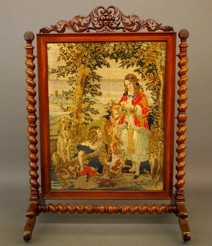 Appraisal: Victorian needlework fire screen A th century Victorian needlework and