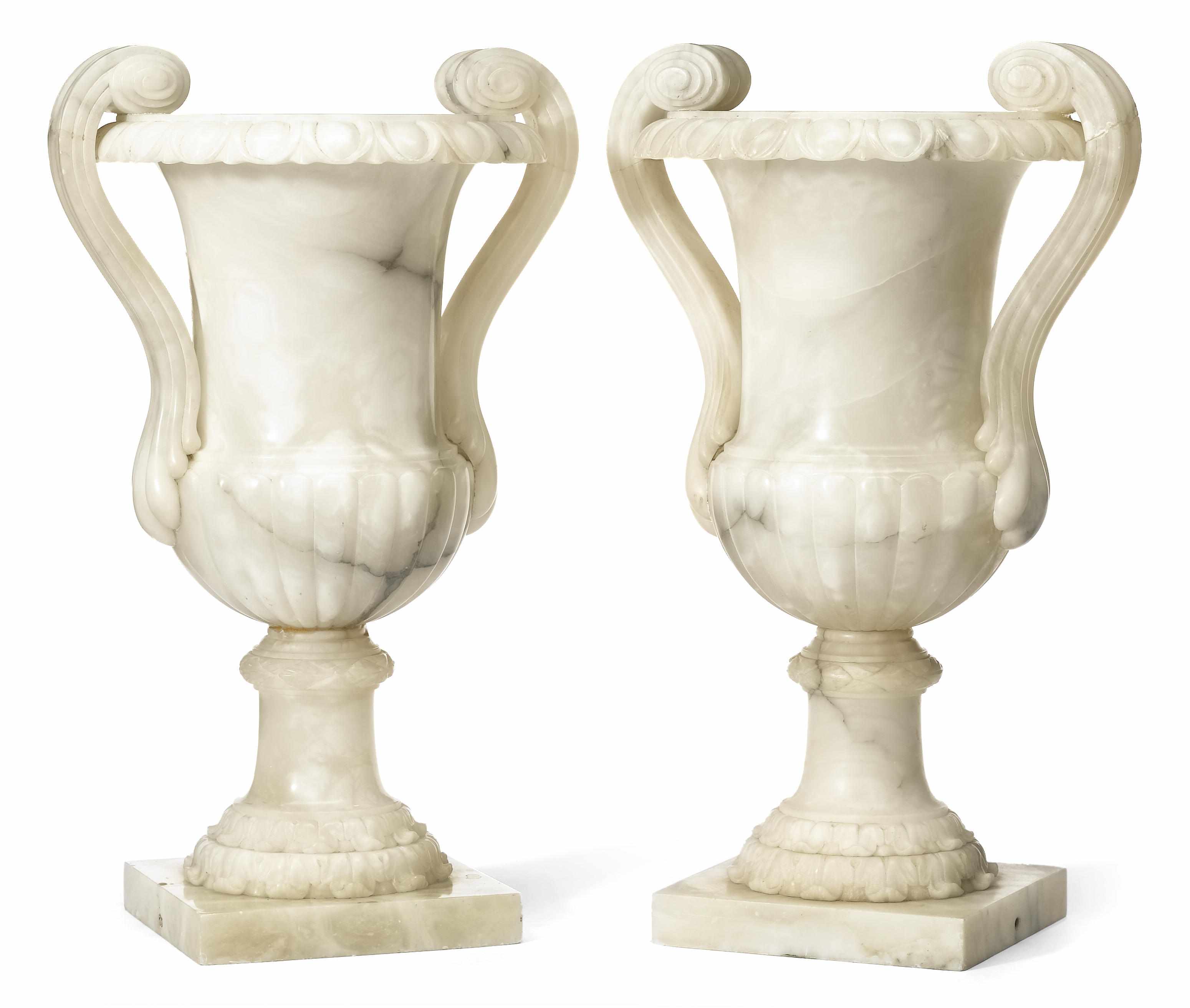 Appraisal: A pair of Neoclassical style carved alabaster urns early th