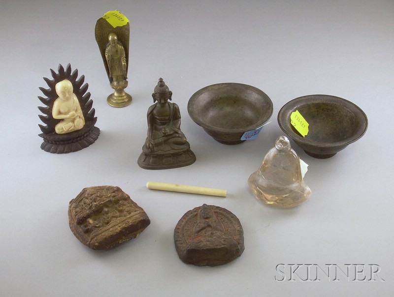 Appraisal: Eight Buddhist Devotional Items including a plaster fragment a circular