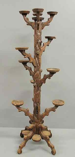 Appraisal: Black Forest carved plant stand in the form of a