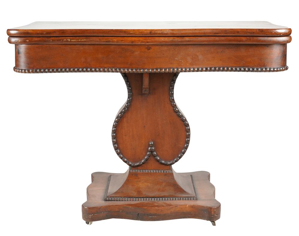 Appraisal: AMERICAN MAHOGANY FLIP-TOP PEDESTAL TABLEthe base raised on casters closed