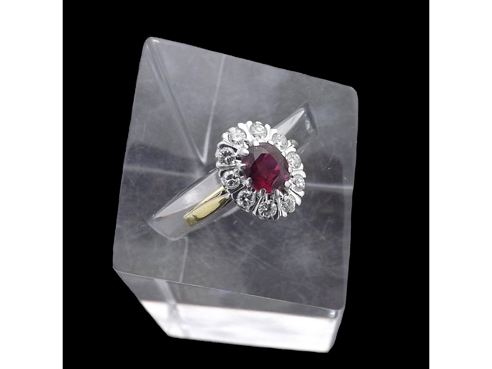 Appraisal: ct ruby and diamond oval cluster ring the oval ruby