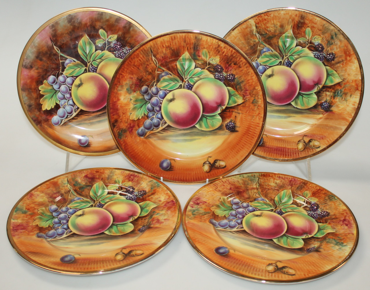 Appraisal: A set of four thC Baroness Pottery plates each decorated