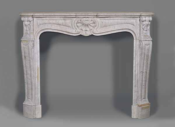 Appraisal: A Louis XVI-Style Carved Marble Mantel the shaped top above