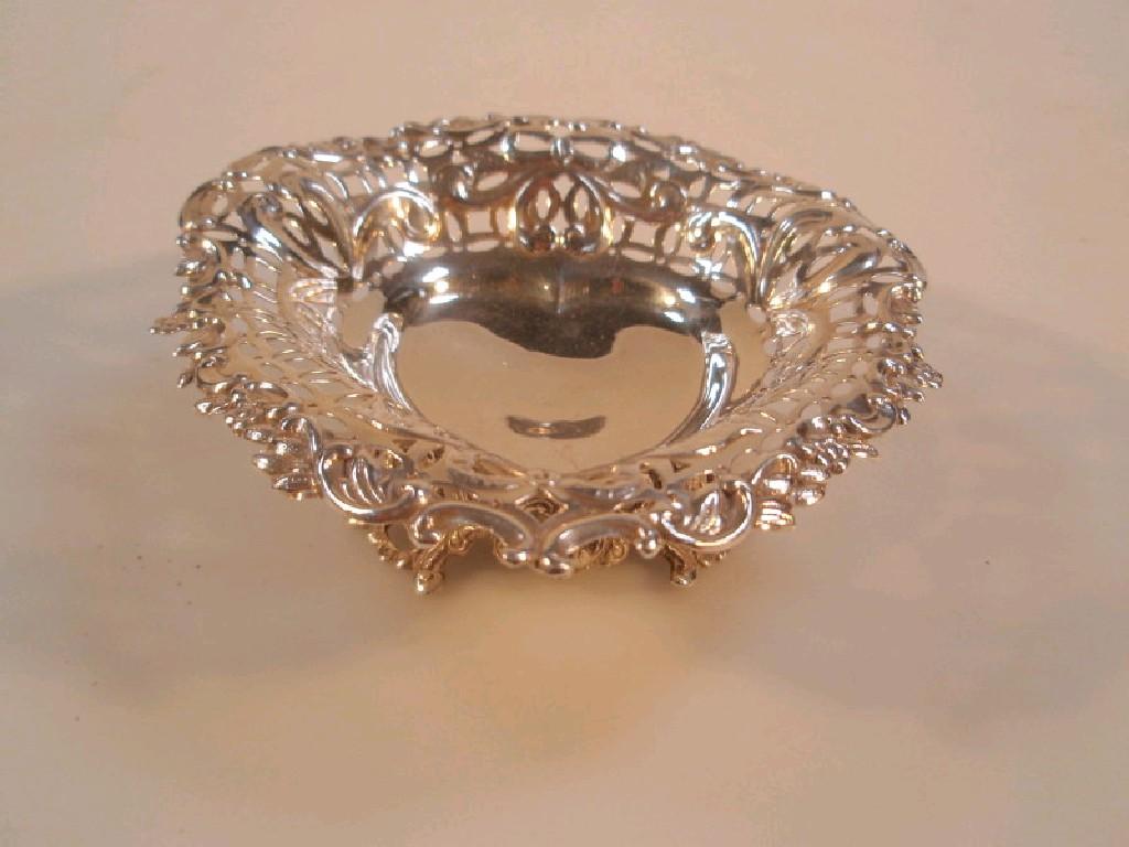 Appraisal: A late Victorian silver heart shaped bonbonier with pierced scroll