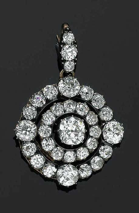 Appraisal: DIAMOND PENDANT ca Silver over red gold Fine round pendant