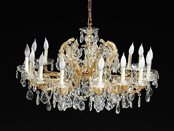 Appraisal: A Rococo style gilt metal and glass sixteen light chandelier