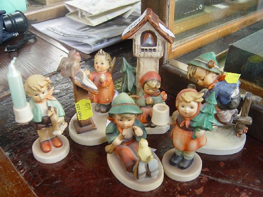 Appraisal: A collection of Goebel figure groups including a little girl