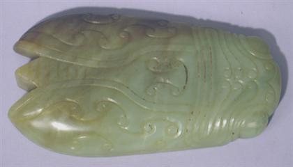 Appraisal: Chinese archaic style celadon and brown russet jade scroll weight