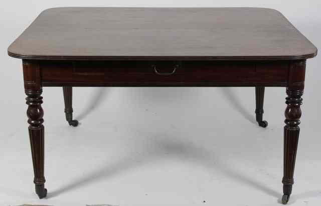 Appraisal: A Regency mahogany extending dining table on reeded taper legs