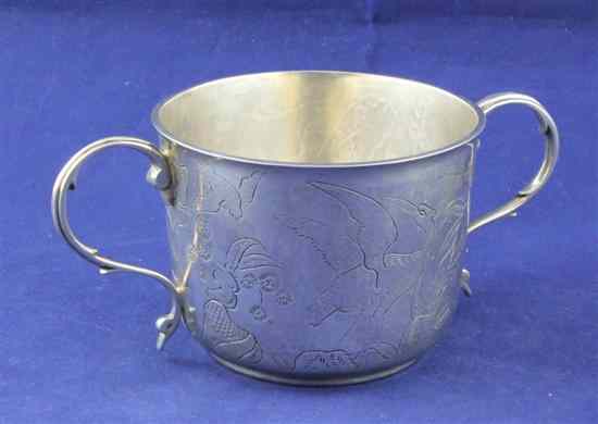 Appraisal: A George V engraved silver two handled porringer decorated with