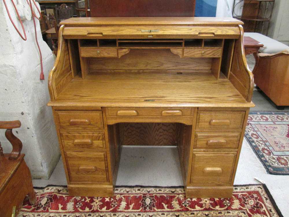 Appraisal: AN OAK ROLL-TOP DESK an antique reproduction by Oak Crest