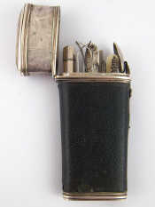 Appraisal: A near complete th c leather covered silver gentleman's etui