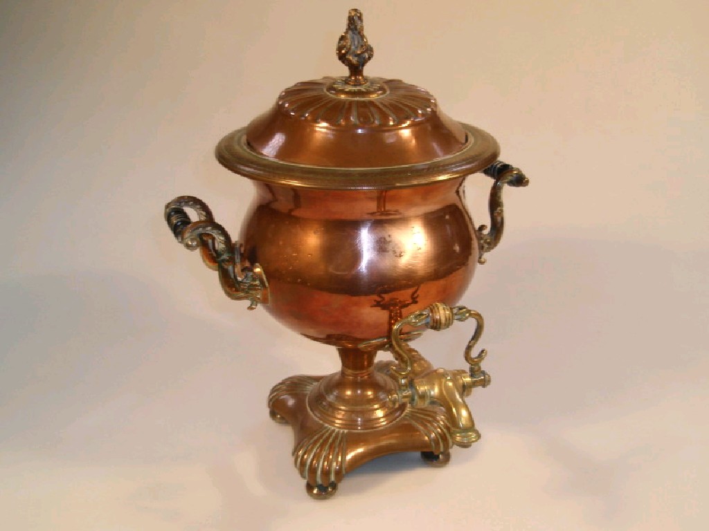 Appraisal: A thC brass and copper samovar with scroll handles and