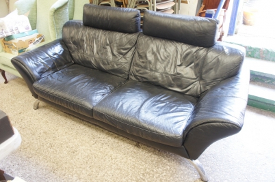 Appraisal: Large black leather seater settee on aluminium legs