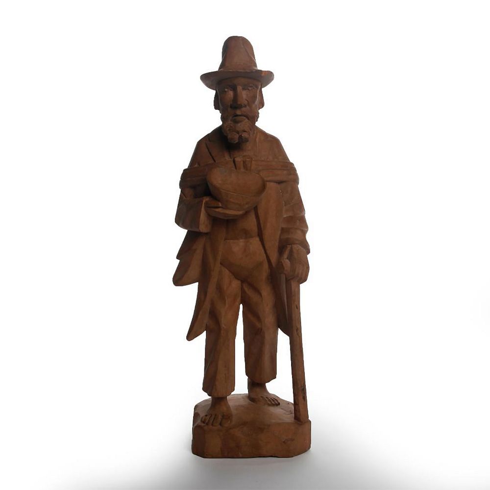 Appraisal: HAND CARVED WOODEN SCULPTURE OF JOHNNY APPLESEED Traveling man planting