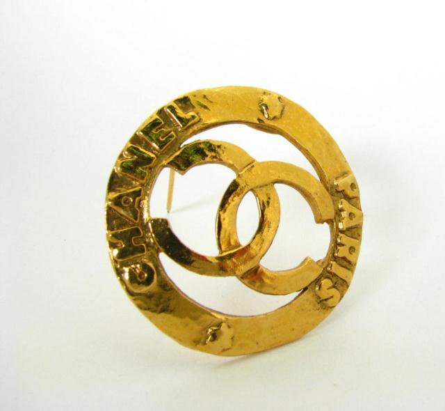 Appraisal: Chanel classic '' diameter open logo brooch