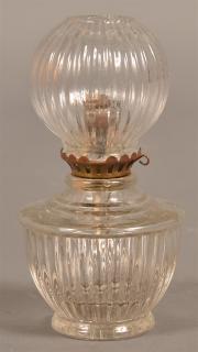 Appraisal: Early Colorless Glass Ribbed Fluid Lamp Marked on base Glow