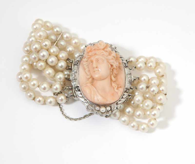 Appraisal: A carved coral and platinum cameo and cultured pearl bracelet